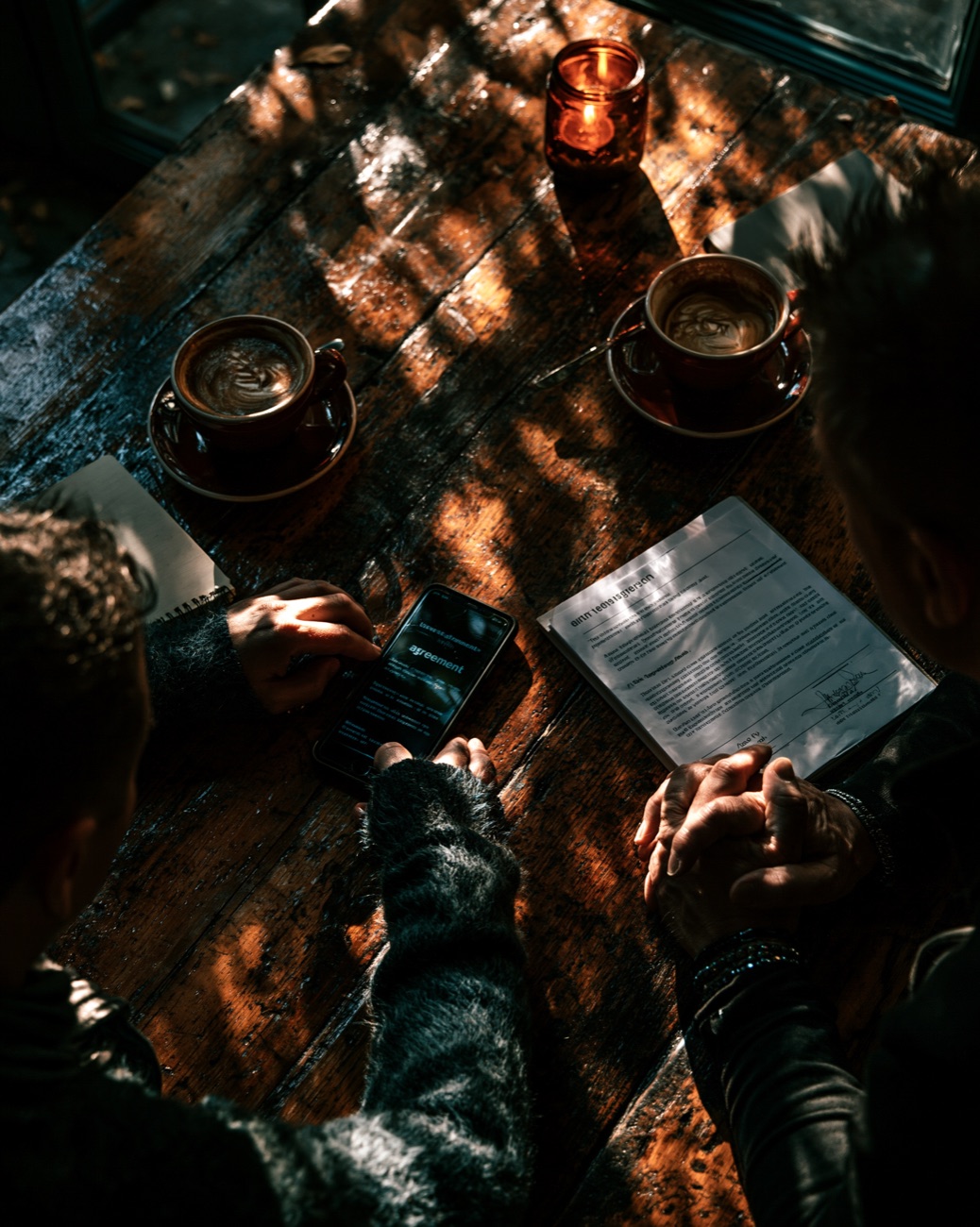 Two people finalizing a deal